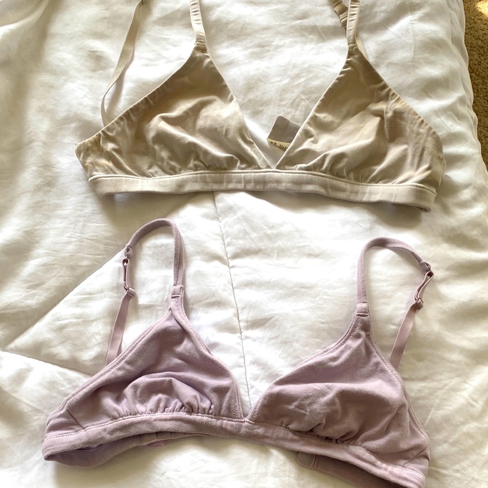3 Skims everyday bras, colors are white, lavender, and black, hardly worn